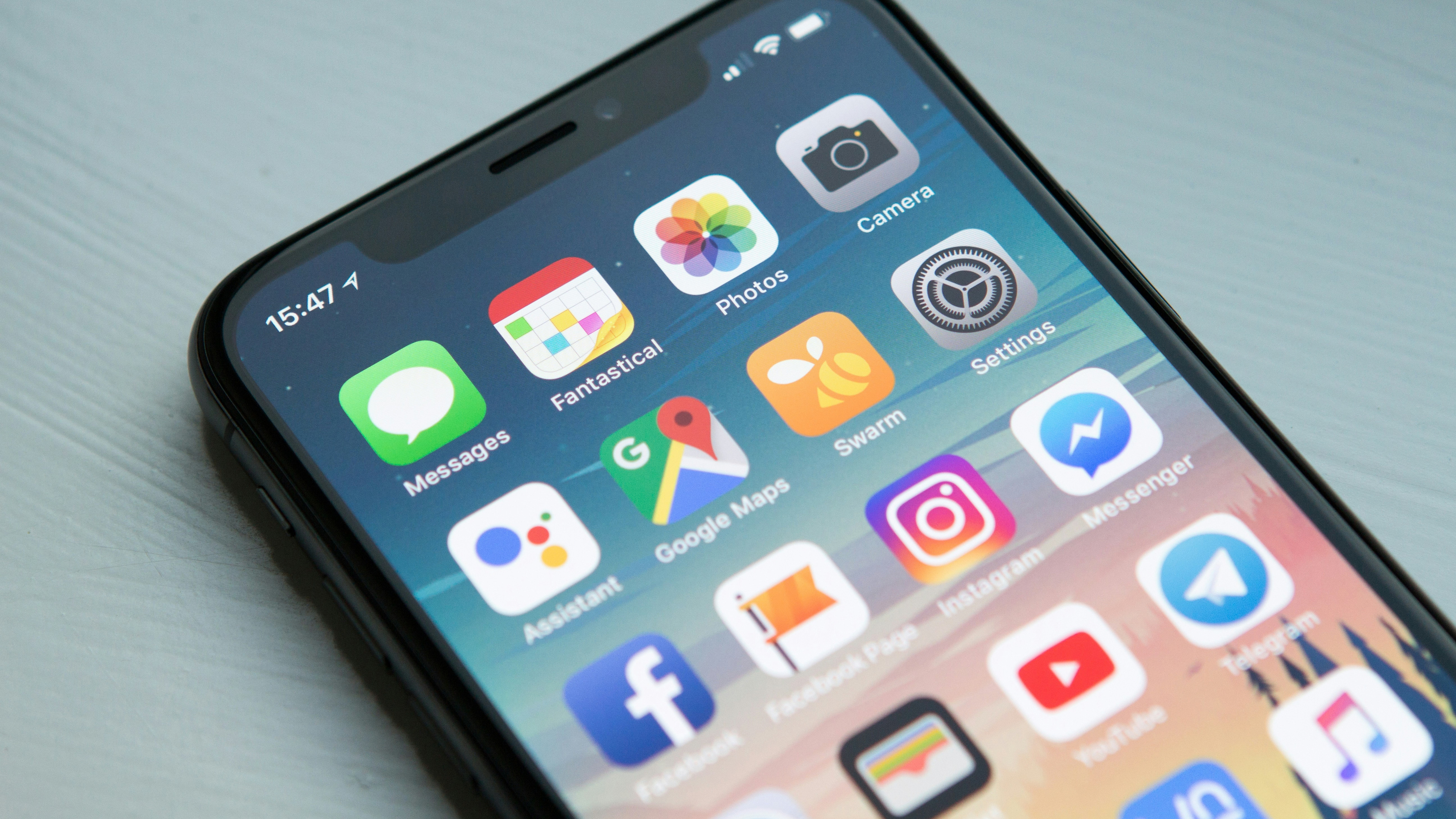 Smartphone home screen filled with mobile app icons